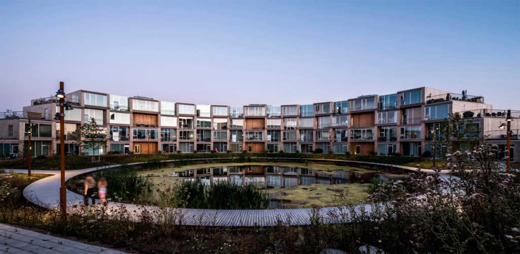 BIG presenta desarrollo de viviendas modulares en forma de espiral en Aarhus